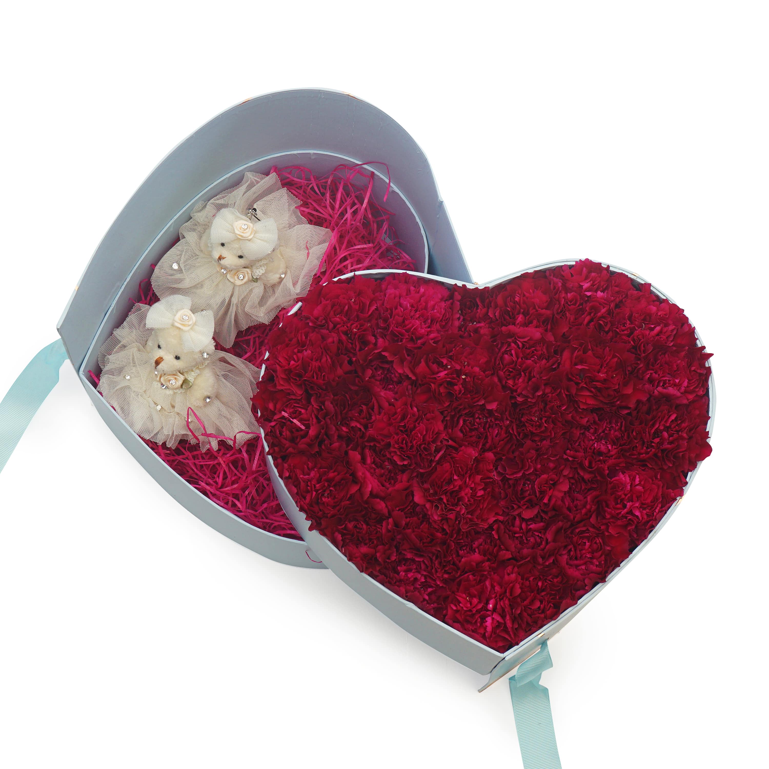 carnations in a heart shaped container